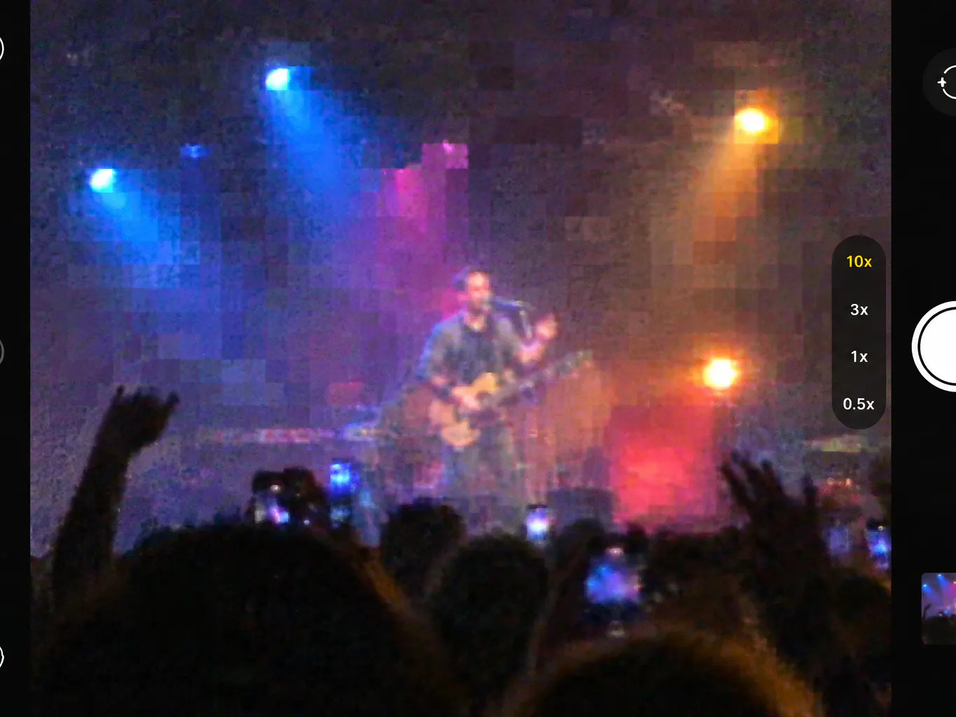 Digital zoom crop of a stage performer, pixelated